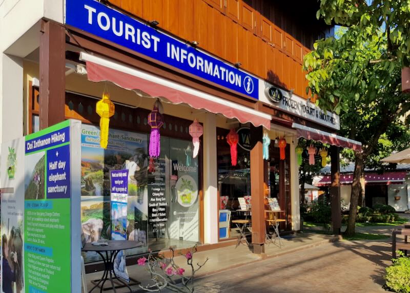 A travel agency with a blue sign.