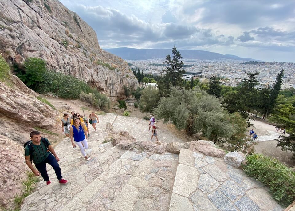 Overhead view of people climbing the marble stairs to the Athens Acropolis