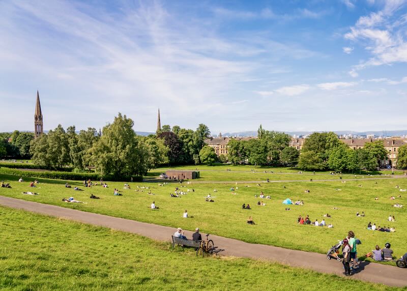 People making the most of a sunny summer's day in Queen's Park, in Glasgow's Southside.