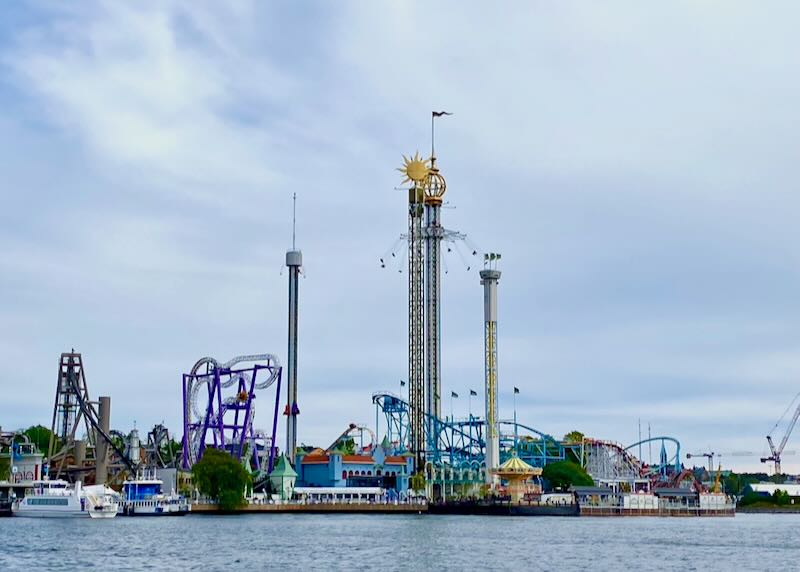 View over the water toward a colorful amusement park