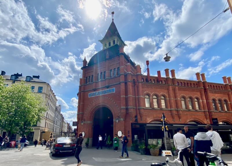 Grand arched corner entrance of a large Swedish food hall