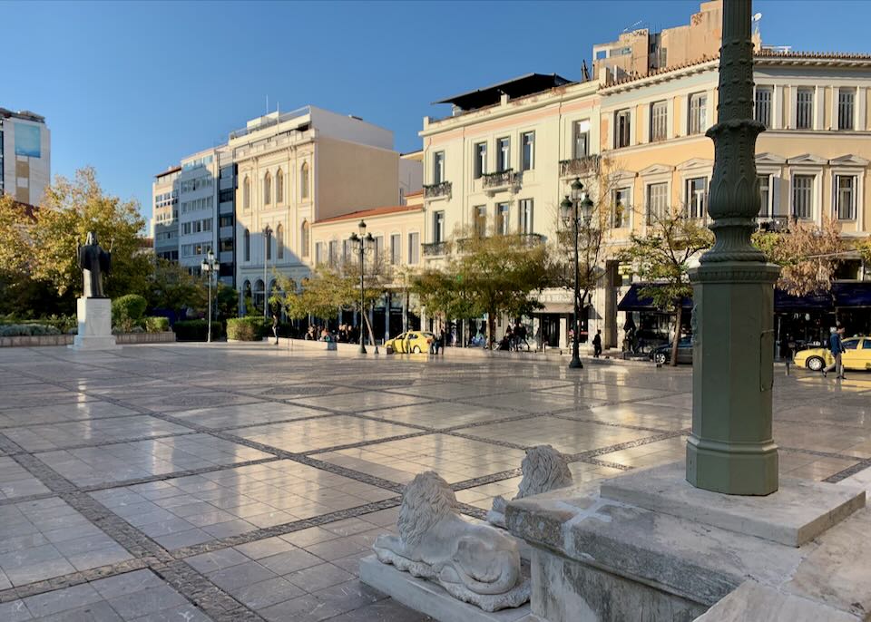 View of a marble pedestrian square, looking out from the front steps of the Metropolitan Cathedral of Athens