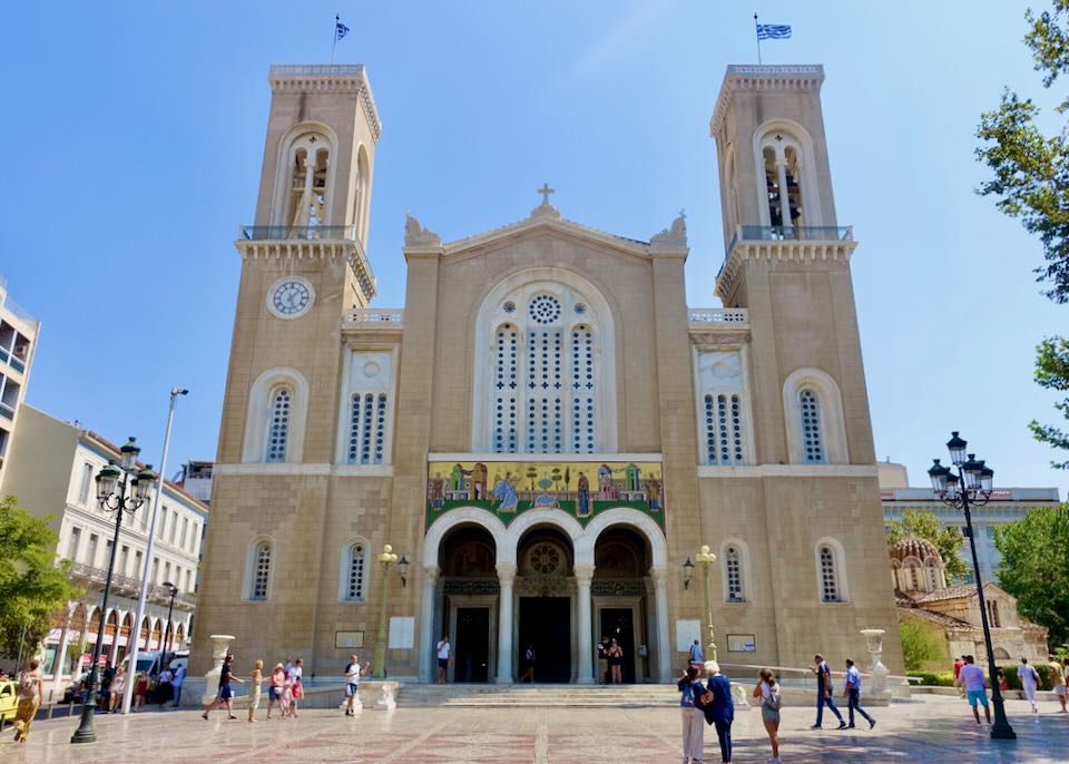 view of the plaza and main entrance of Athens Metropolitan Cathedral on a sunny day