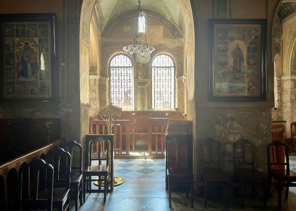 Light streaming in through the windows of a side chapel in a Greek Orthodox church