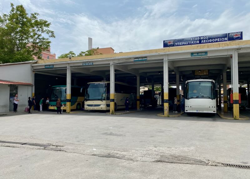 Buses wait in the covered bays in a bus station
