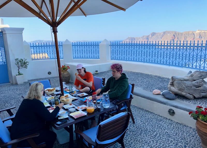 My family eating breakfast in Santorini.