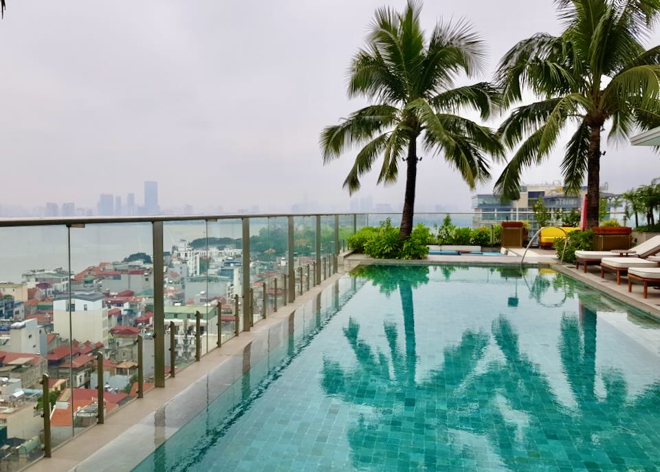 A rooftop pool has a glass railing to view the city though.