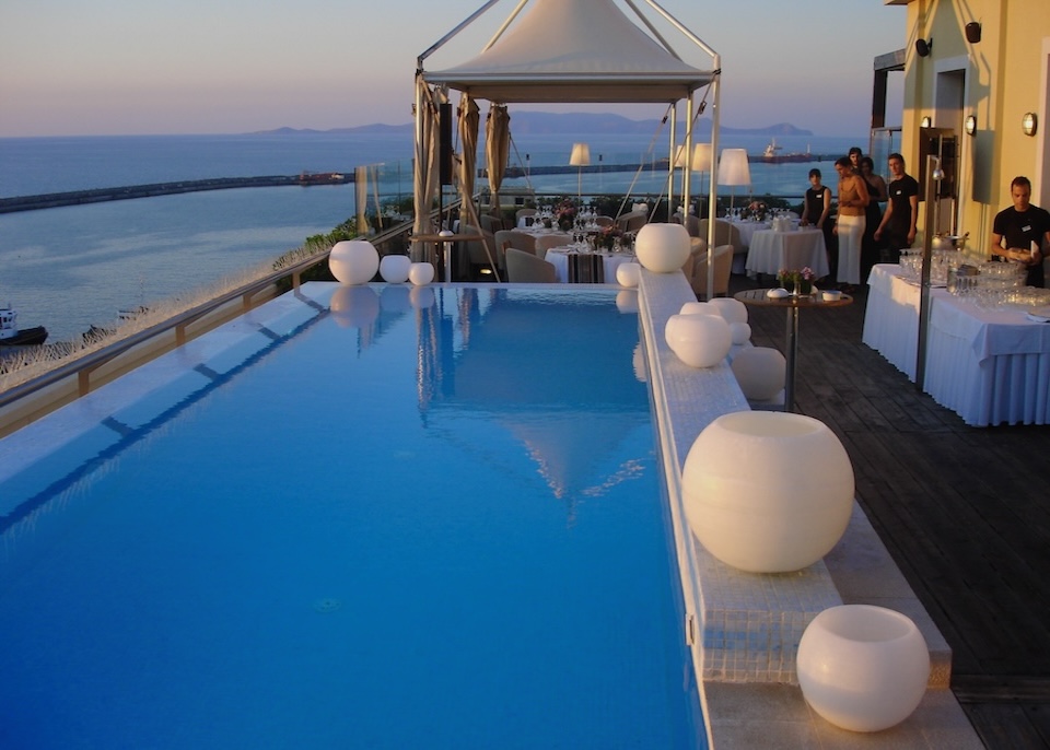 Rooftop pool in the evening set up for a formal event at GDM Megaron hotel in Crete