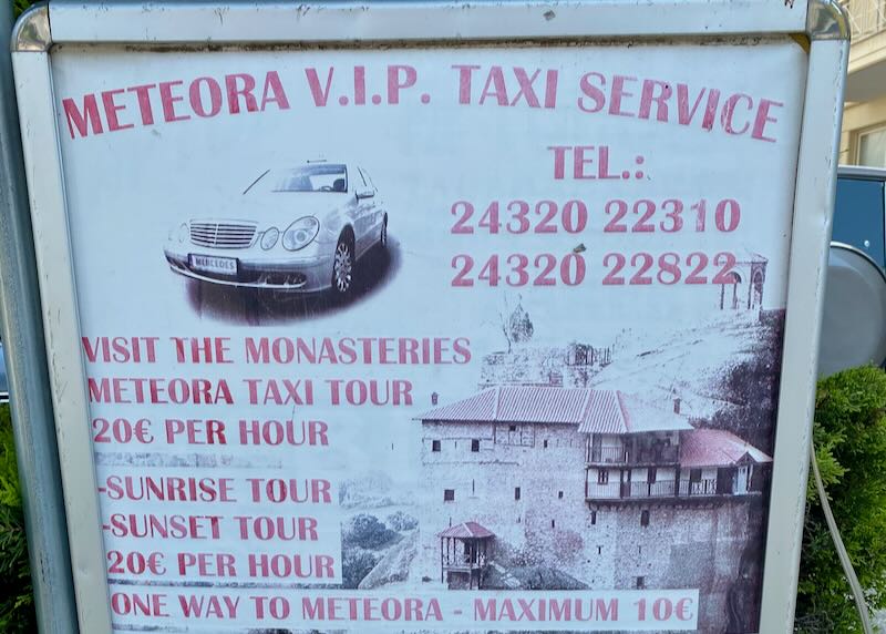 Sign advertising taxi service to the meteora in Greece