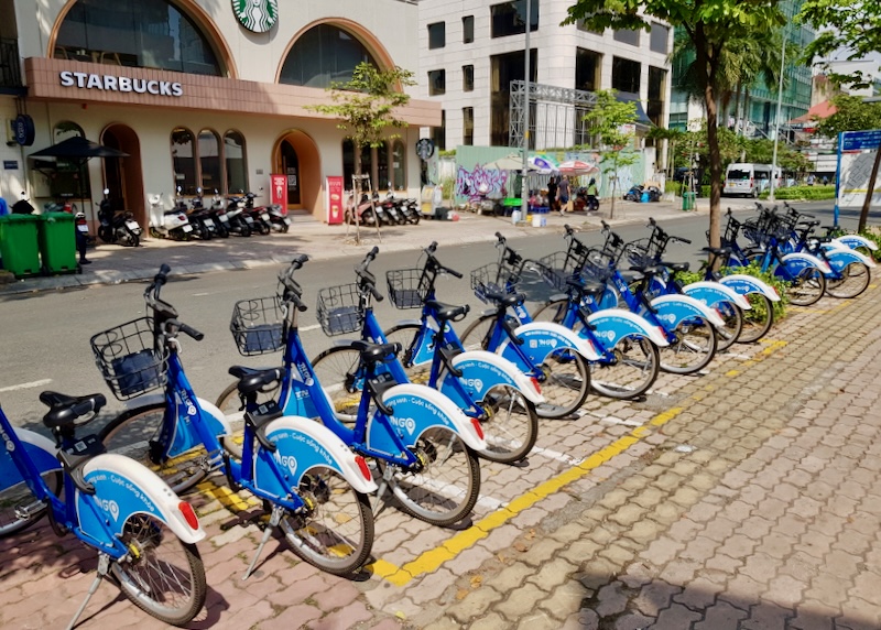 A row of rentable blue bikes.