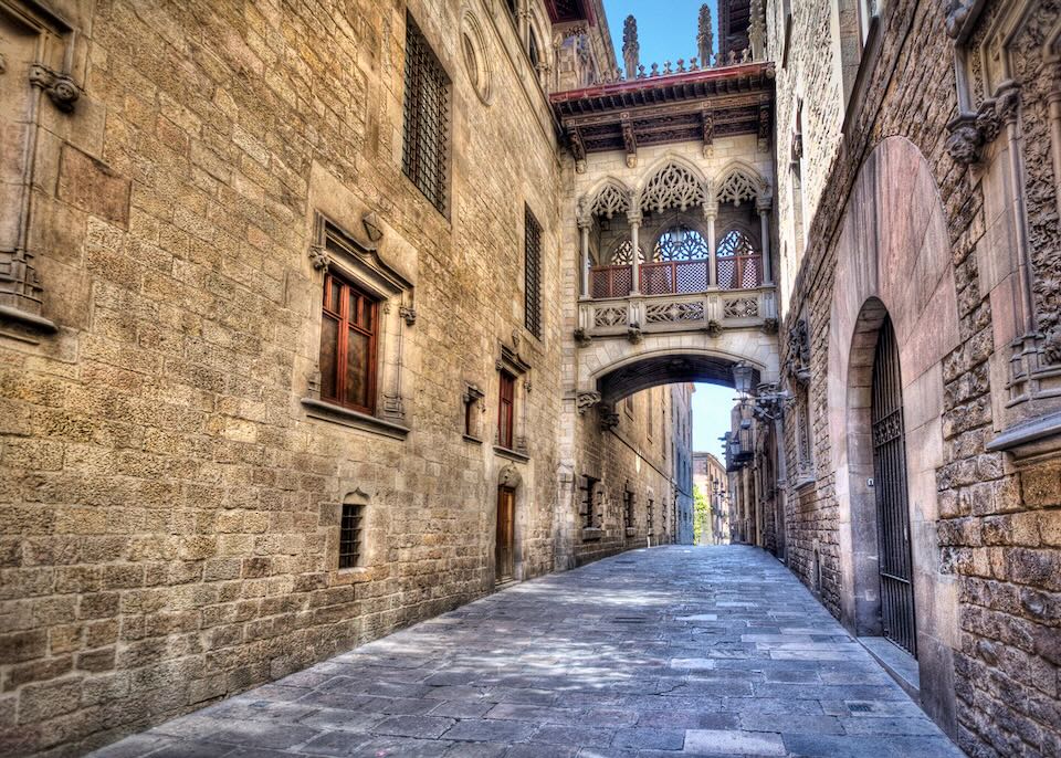 Flamboyant style bridge between buildings in El Bisbe street in the Gothic Quarter in central Barcelona, Spain