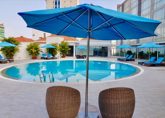 A small round pool sits next to lounge chairs.