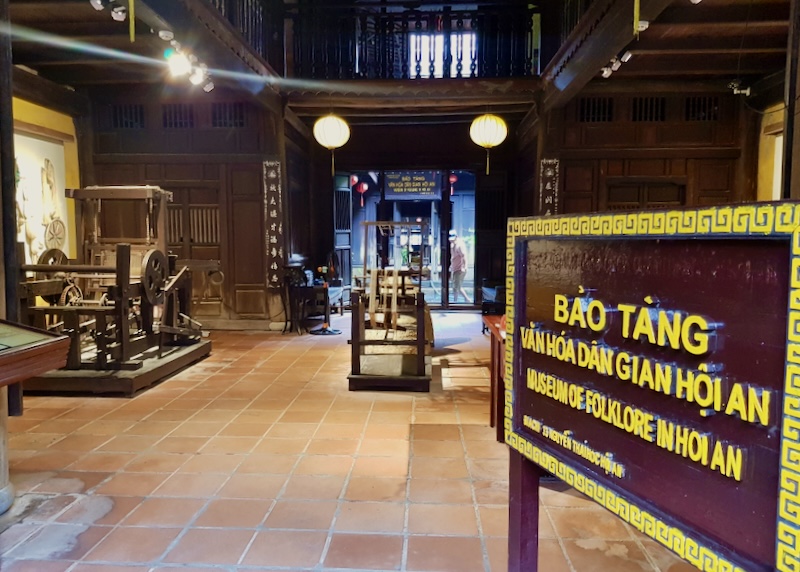 A yellow sign reads, "Museum of Folklore in Hoi An."