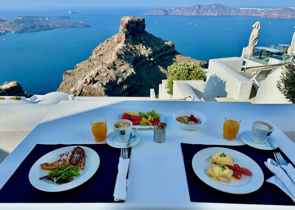 Breakfast with a view of Skaros Rock and the caldera at a hotel in Santorini