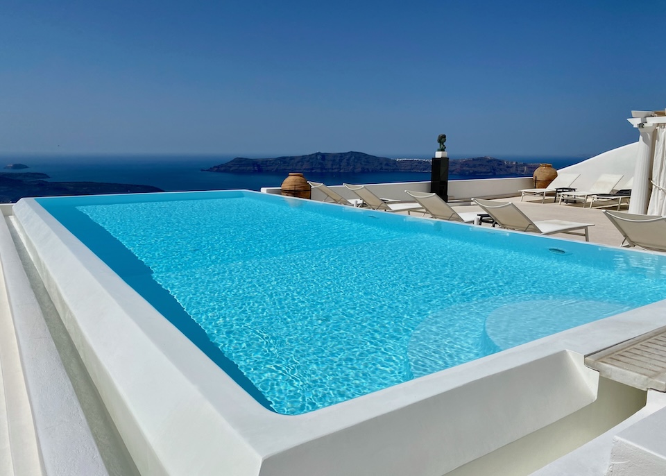 An infinity pool overlooking the caldera and volcanoes in Santorini