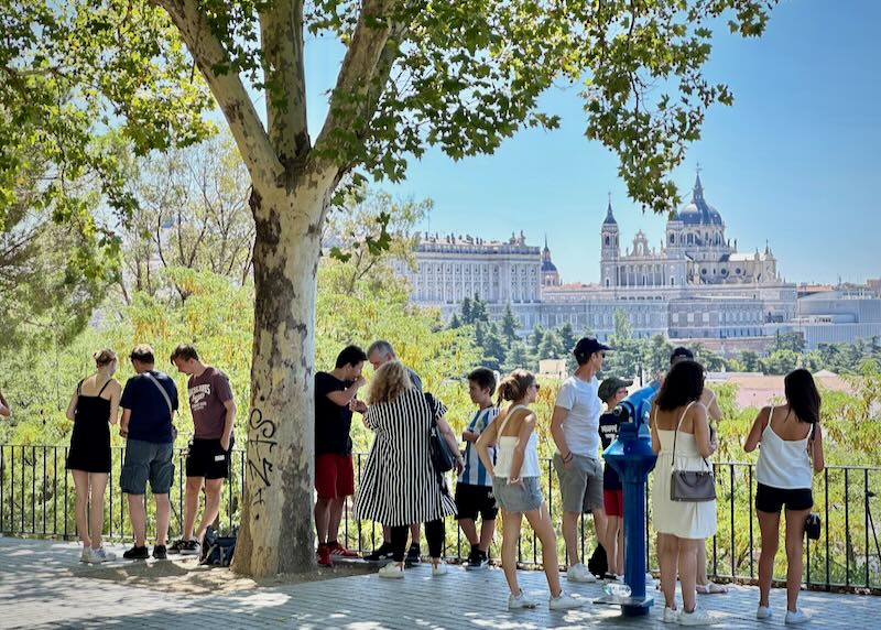 People at an overlook to view a sunset in Madrid