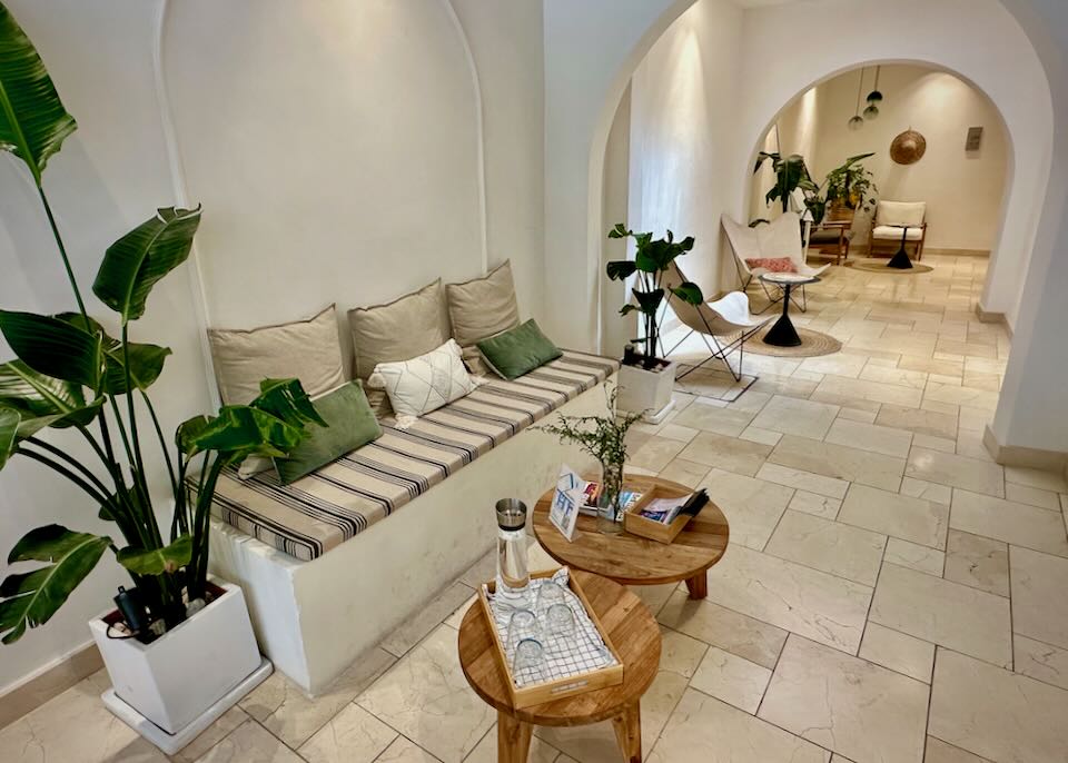 Bright and airy hotel entryway with arched passageway