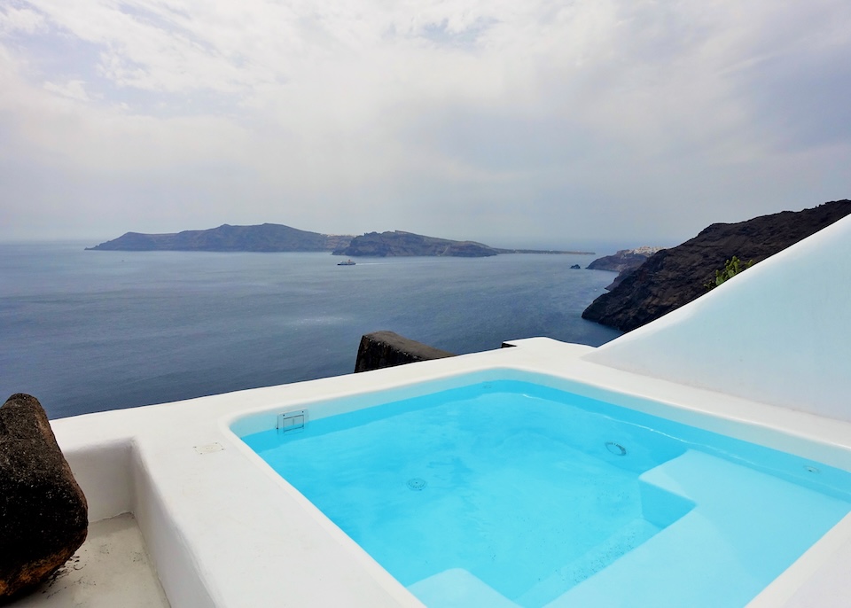 Plunge pool overlooking the caldera and Thirassia Island at Aenaon Villas in Imerovigli, Santorini.