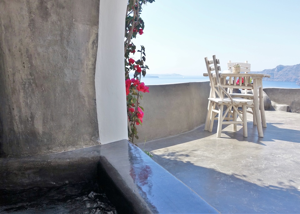 The view from inside a cave pool toward the terrace and caldera at Andronis Boutique Hotel in Oia, Santorini.