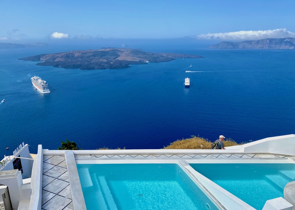 Two side-by-side private plunge pools above the volcano and caldera at Anteliz Suites in Firostefani, Santorini.