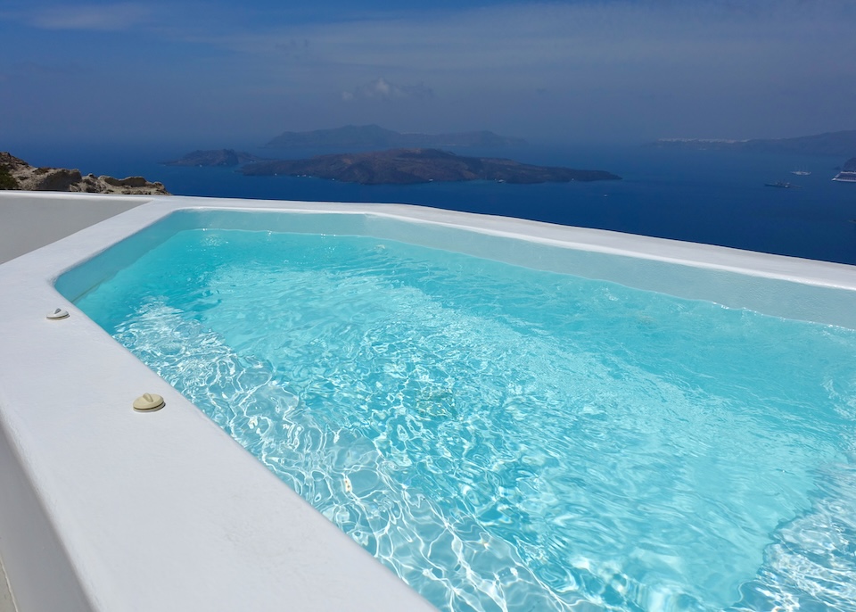 A private plunge pool on the caldera's edge overlooking the volcanoes at Alti Suites in Megalochori, Santorini.