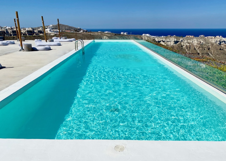 A long pool facing the caldera at Cocomat Hotel in Akrotiri, Santorini.