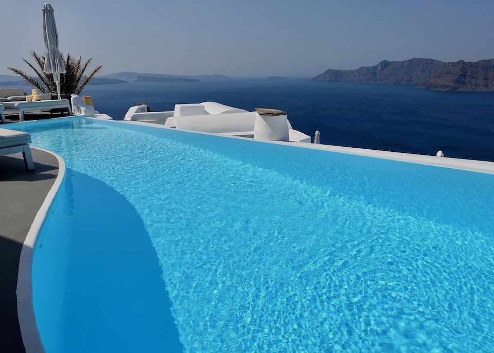 An infinity pool overlooks the caldera at Katikies Hotel in Oia, Santorini.