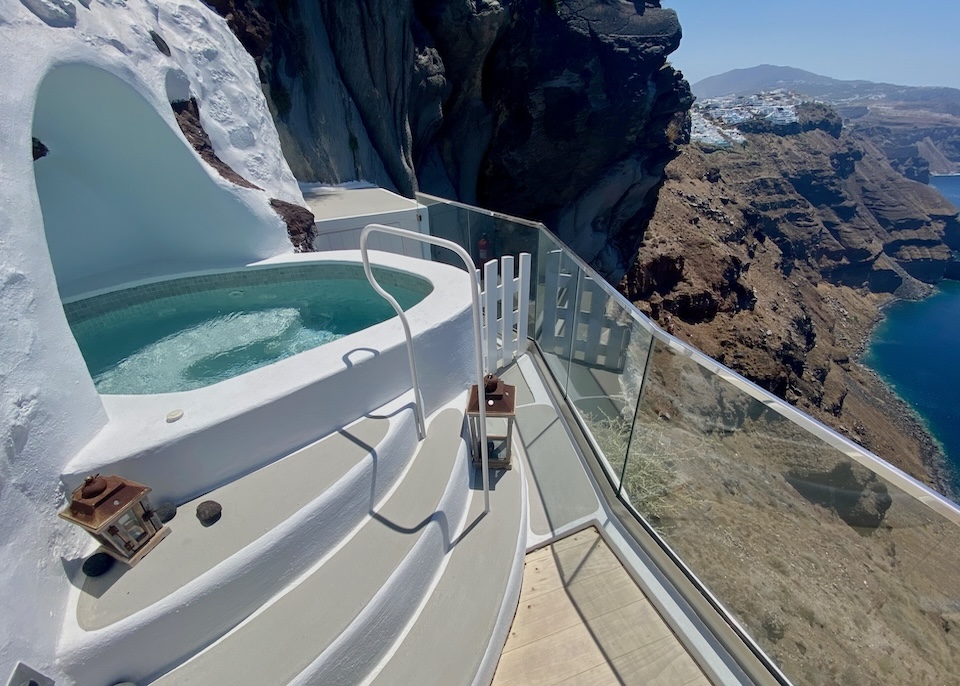 A jetted cave plunge pool on the caldera's edge at Iconic hotel in Imerovigli, Santorini.