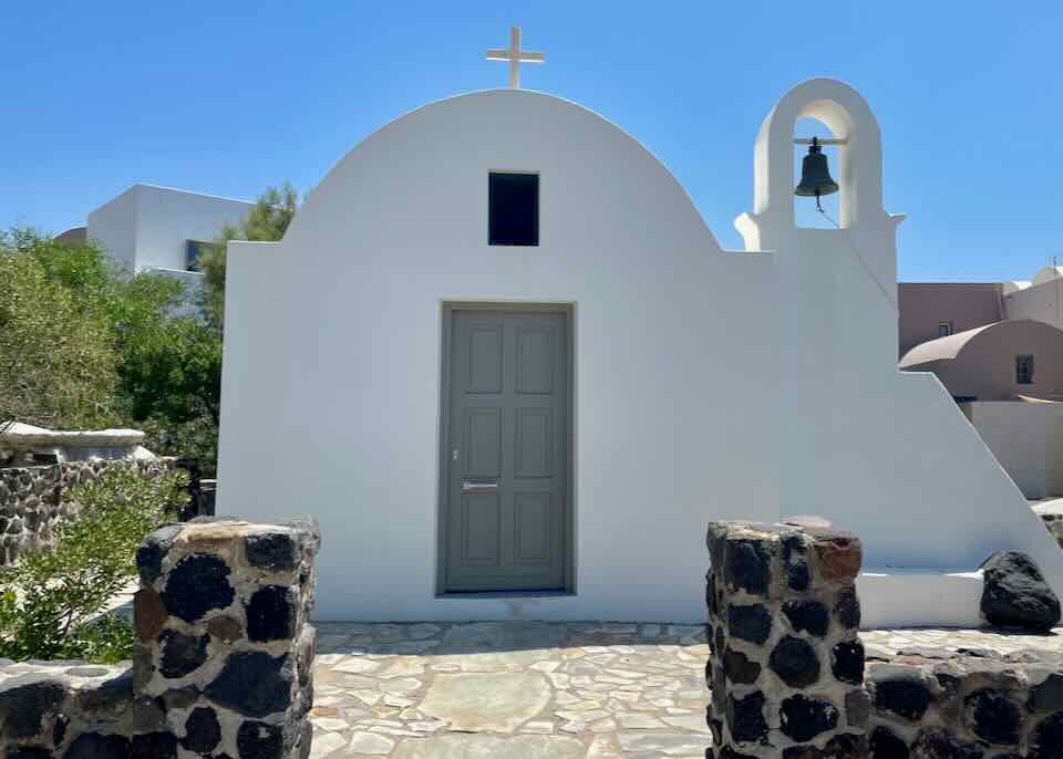 Hotel with church in Santorini.