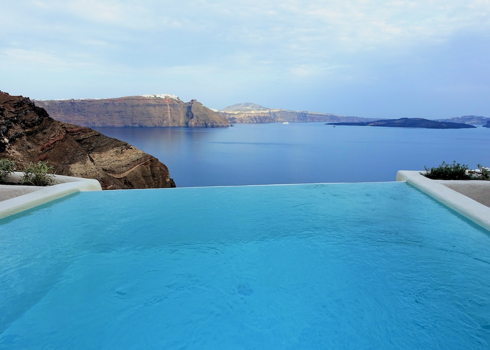 A private infinity pool overlooking the caldera at Mystique hotel in Oia, Santorini.