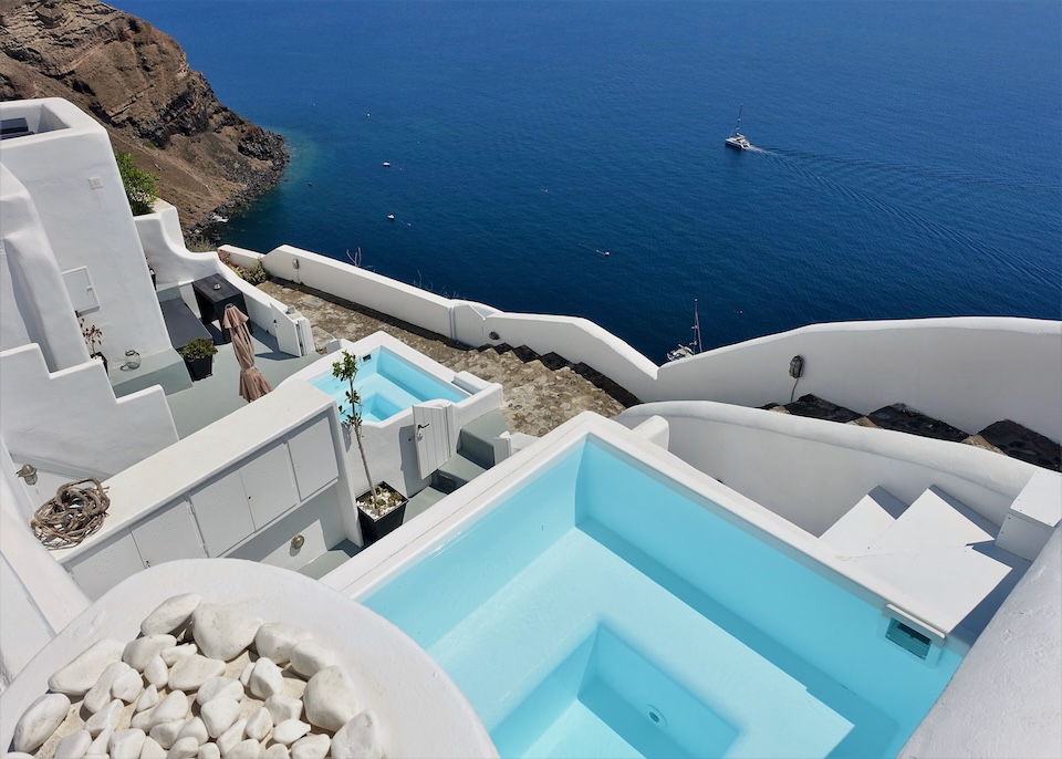 Two private plunge pools on different terrace overlooking the caldera at White Pearl Villas in Oia, Santorini.