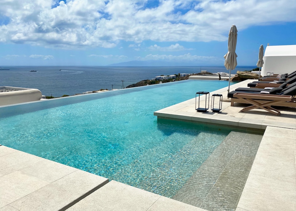 An infinity pool faces out over the sea from the hills above at Kalesma hotel in Aleomandra, Mykonos.