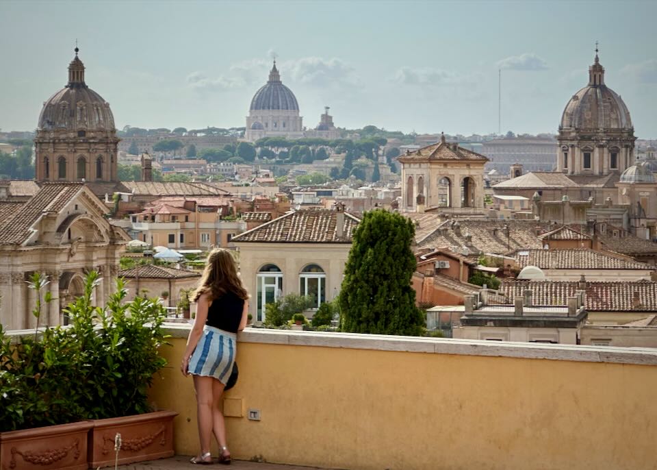 A young woman looks over the historic center of Rome