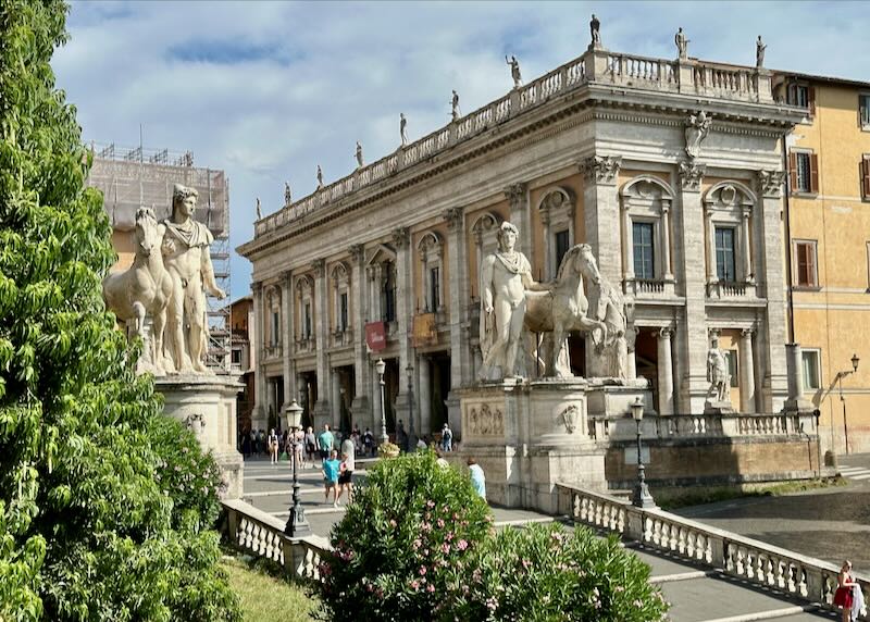 Wide marble stairway leading up to ornate museum buildings in Rome