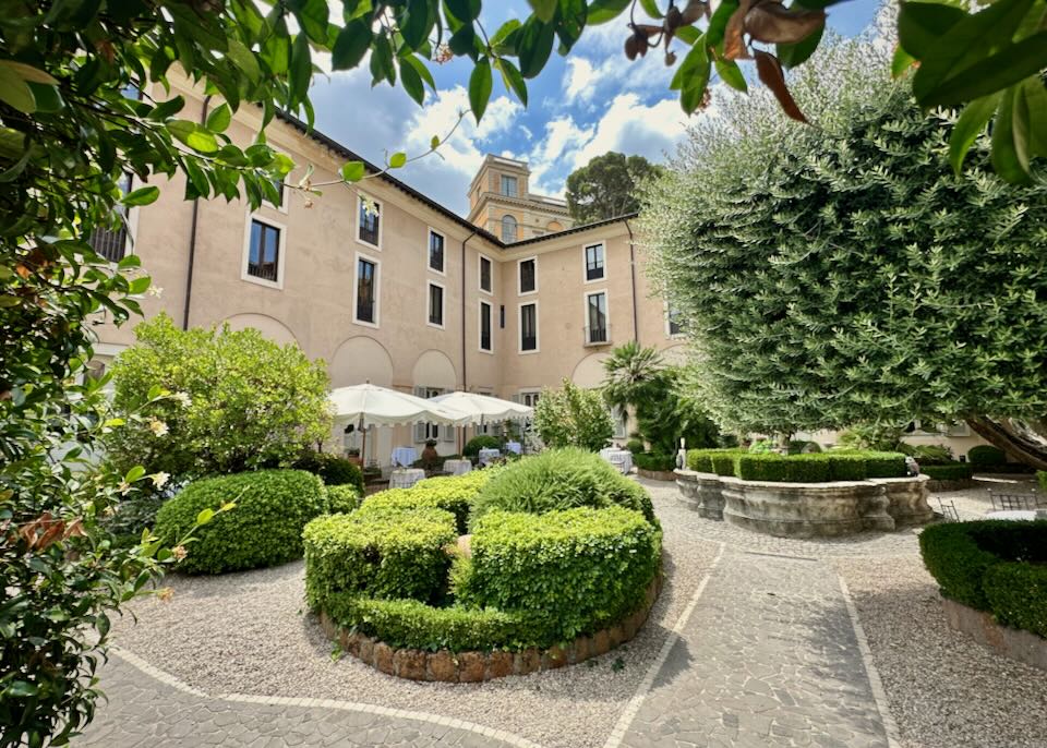 Exterior garden courtyard of a rustic Italian hotel