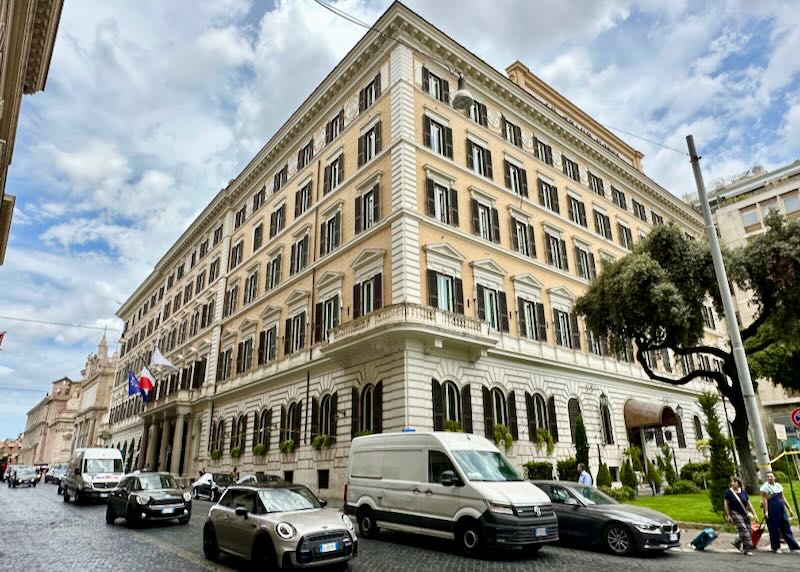 Corner exterior view of a Roman hotel building