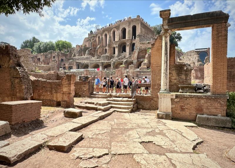 Group of tourists on a guided tour of the Roman Forum.