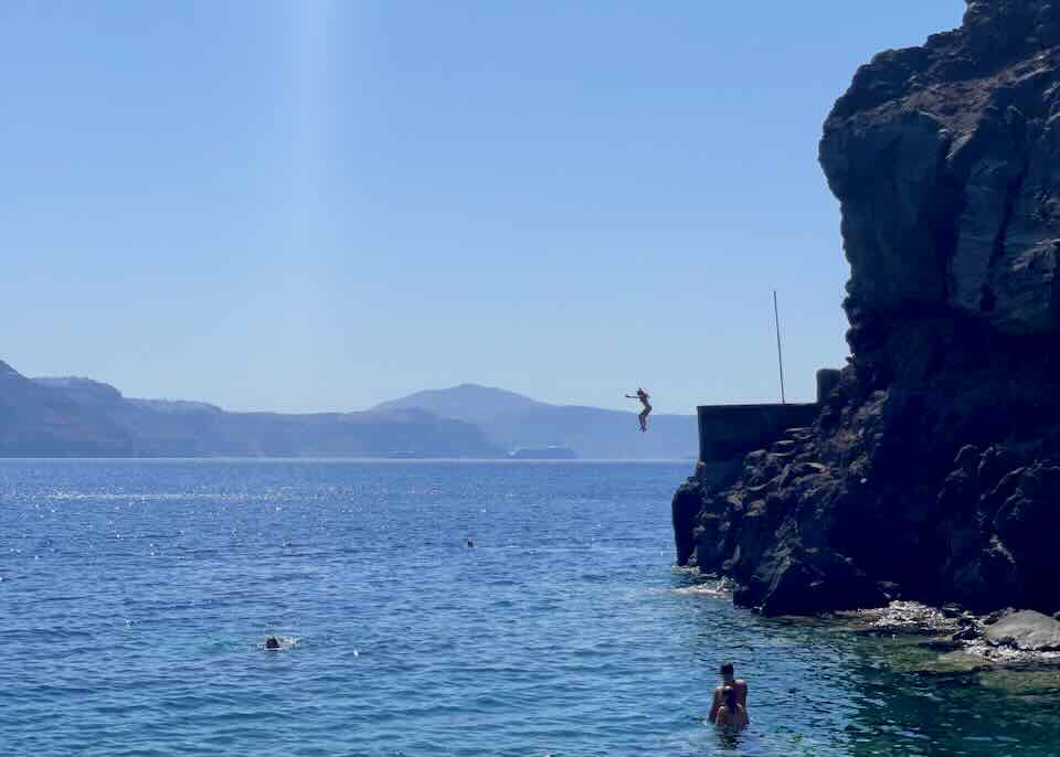 Cliff jumping in Santorini.