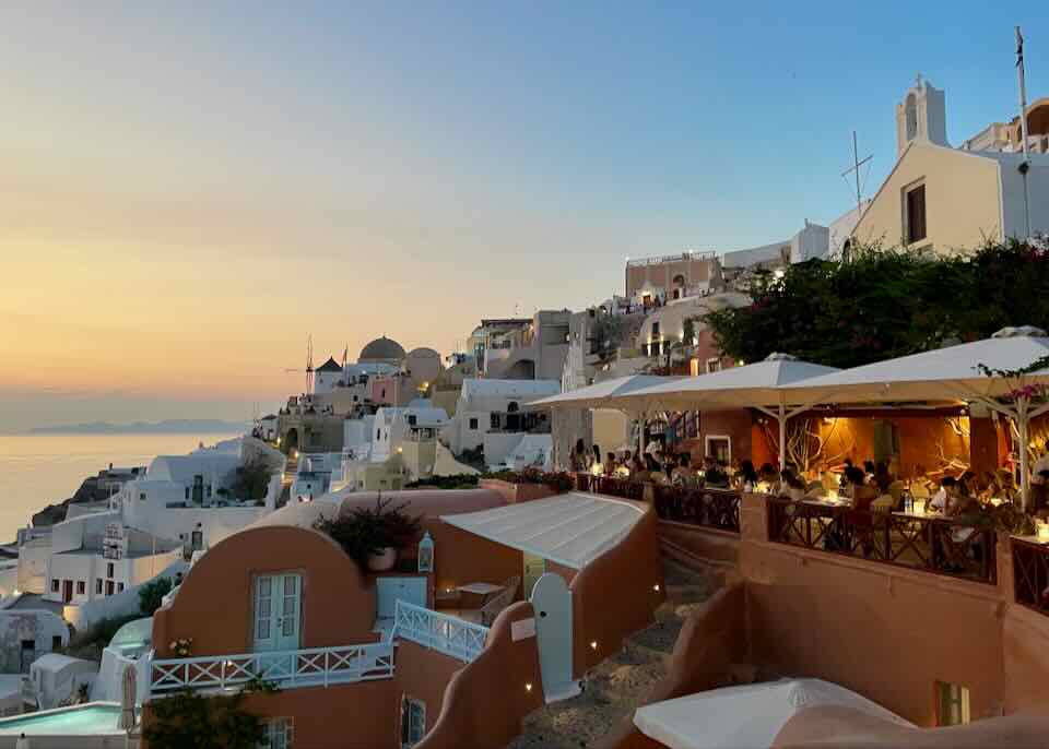 Oia restaurant with sunset view.