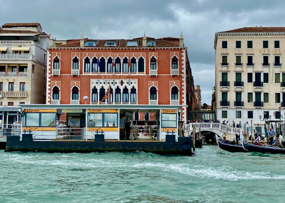 View from the canal of a Venice hotel with a vaporetto stop in front