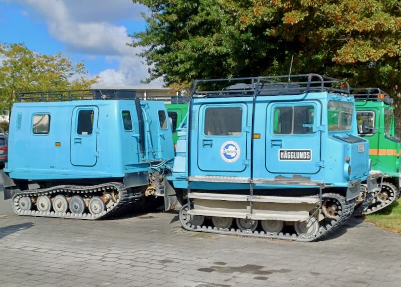 Small blue square vehicles with track wheels, like a tank.