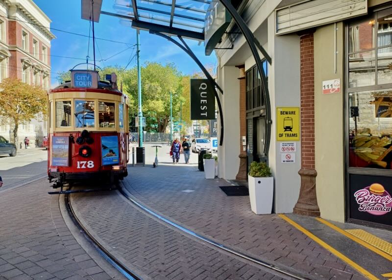 A tram follows curved tracks.