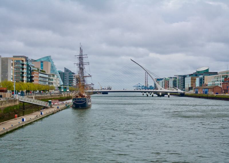 River Liffey with Samuel Beckett Bridge and Jeanie Johnston Tall Ship in Dublin, Ireland