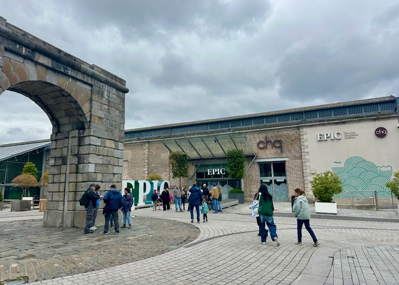 Exterior of Dublin's EPIC Emigration Museum, with people milling around in front