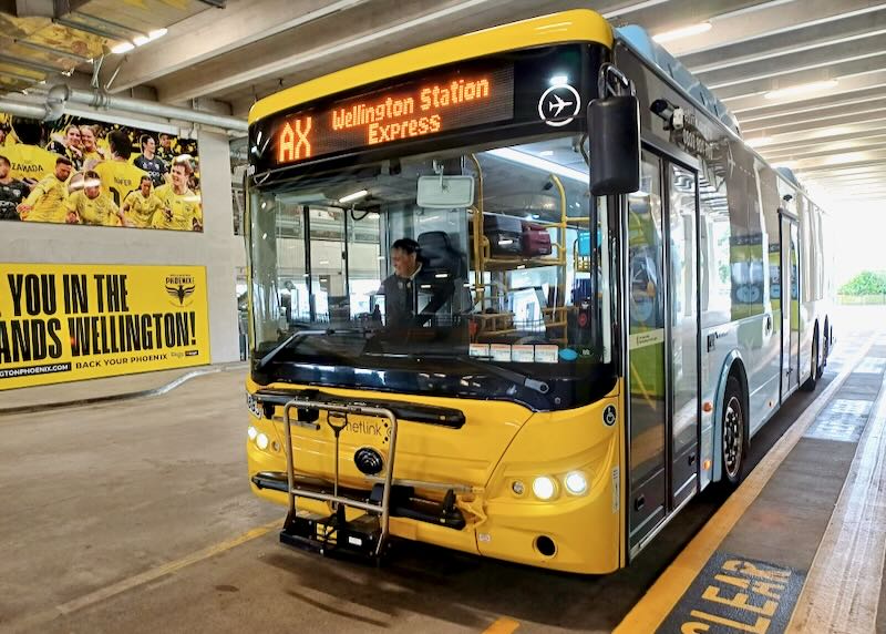 A bus driver stops the bus at the station.