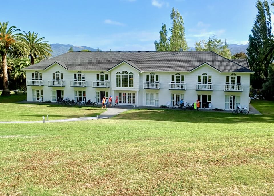 A large white two-story lodge.