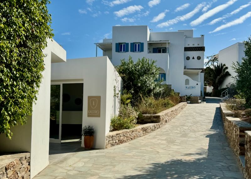 Boxy white exterior of a Greek hotel