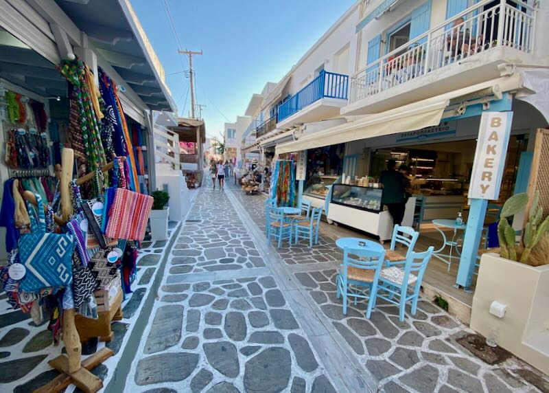 Cobbled alleyway lined with shops and eateries.