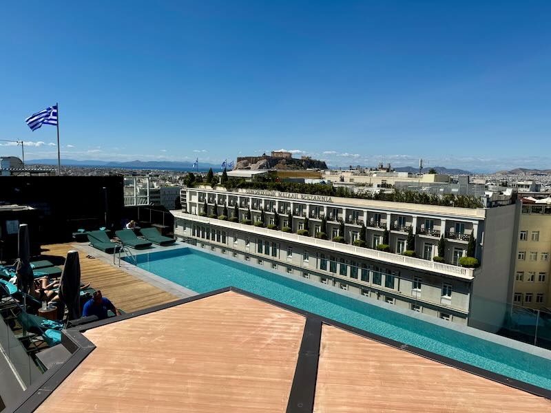 Hotel rooftop swimming pool with view of the Acropolis in Athens