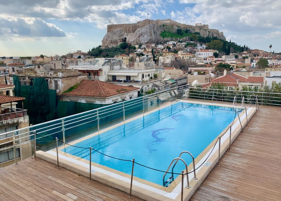 Hotel swimming pool with view of the Acropolis in Athens.